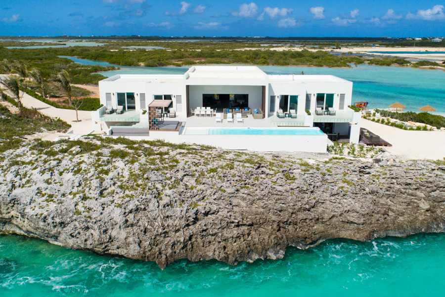 Why do the stars come to the Turks & Caicos Islands?
